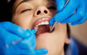 a young woman having a dental procedure performed on her