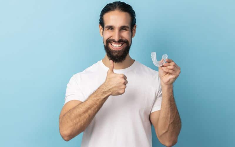  man holding a mouth guards