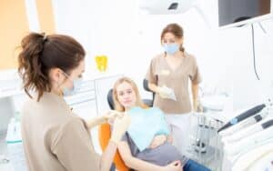 pregnant woman at the dentists office checkup and dental treatment for pregnant women